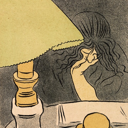Femme lisant près d’une lampe