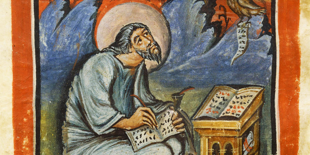 Saint Jean écrivant dans un codex