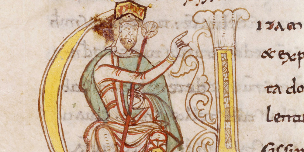 Lettrine V historiée : Charlemagne assis