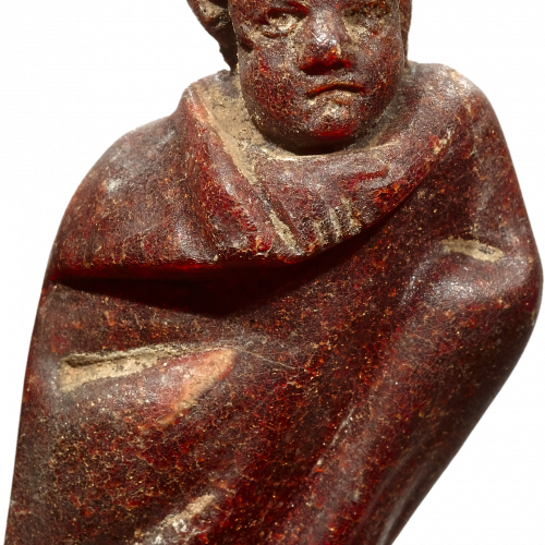 Figurine romaine en ambre représentant un enfant drapé dans son vêtement